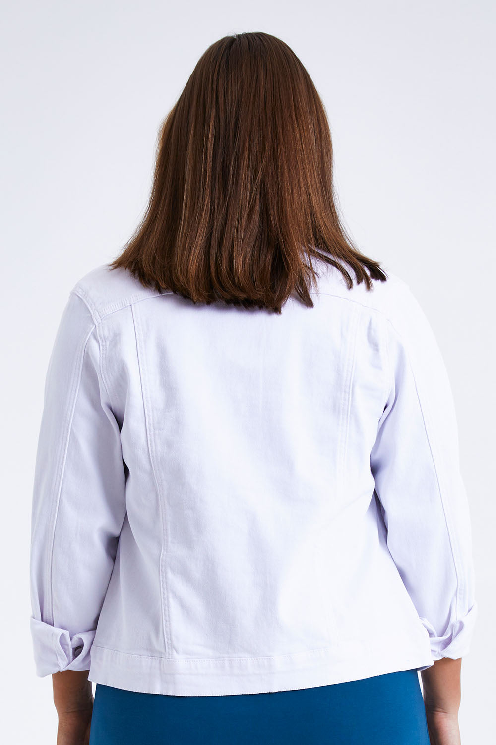 Model Monique wearing size 14 of The Slim Fit Denim Jacket in colour White (White), from the back