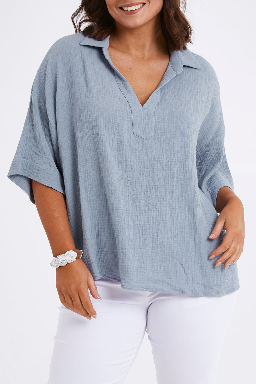 Model Monique wearing size 14 of The Double Cotton Collar Top in colour Chambray (Blue), from the front, cropped image