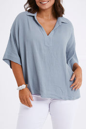 Model Monique wearing size 14 of The Double Cotton Collar Top in colour Chambray (Blue), from the front, cropped image