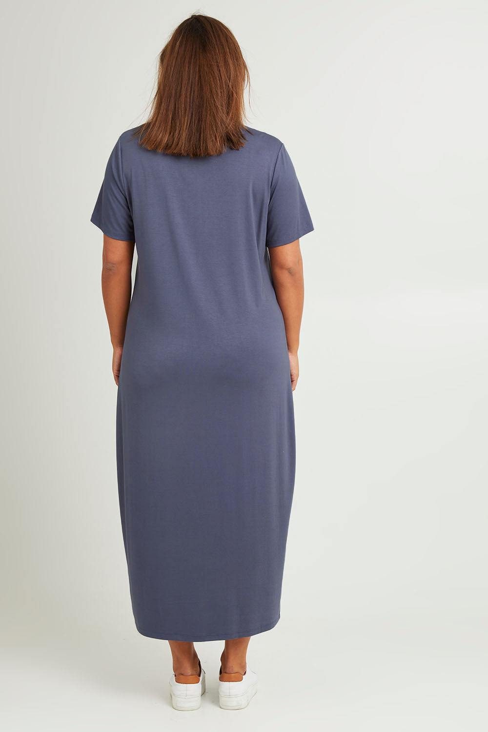 Model Monique wearing size 14 of The V Neck Bamboo Maxi Dress in colour Dustyblue (Blue), from the back