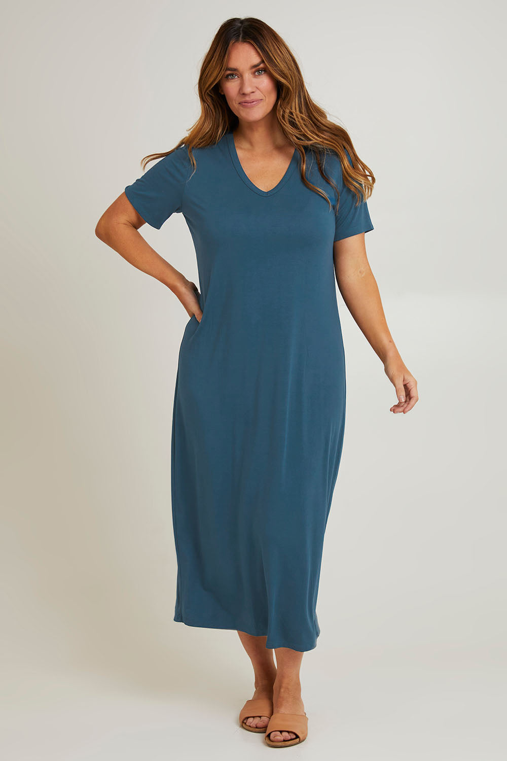 Model Laura wearing size 14 of The V Neck Bamboo Maxi Dress in colour Oceanblue (Blue), from the front, showing the whole outfit