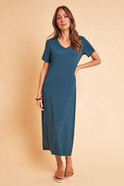 Model Madeline wearing size 10 of The V Neck Bamboo Maxi Dress in colour Oceanblue (Blue), from the front, showing the whole outfit