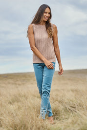 Model Amanda wearing size S of The Soft Sleeveless Cable Knit Jumper in colour Capuccino, from the front, showing the whole outfit