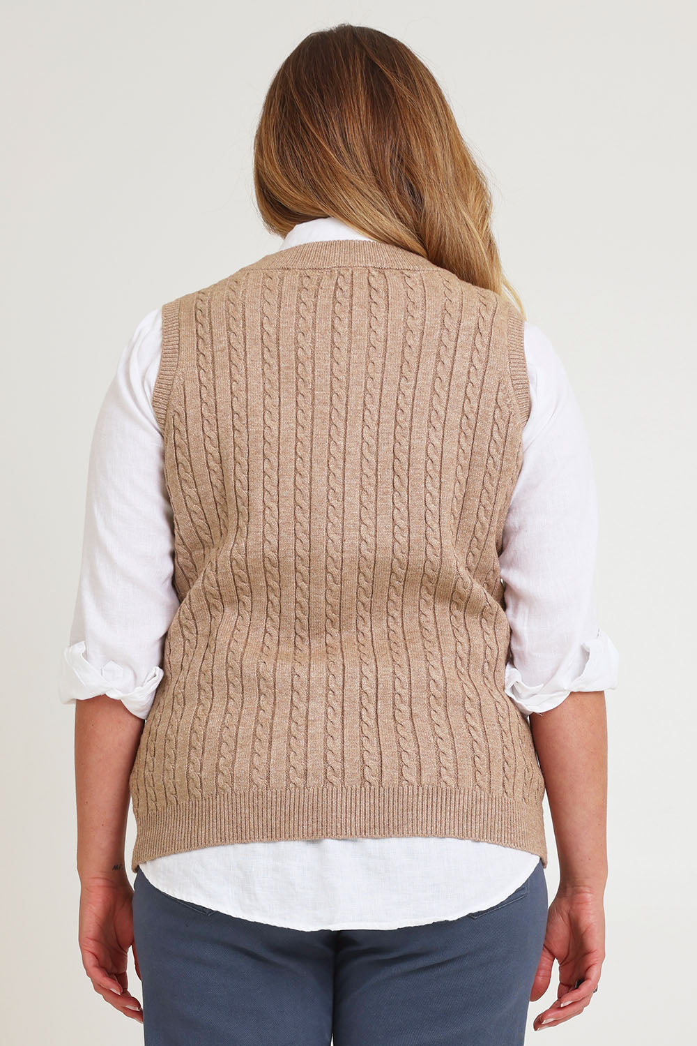 Model Chanel wearing size XL of The Soft Sleeveless Cable Knit Jumper in colour Capuccino, from the back