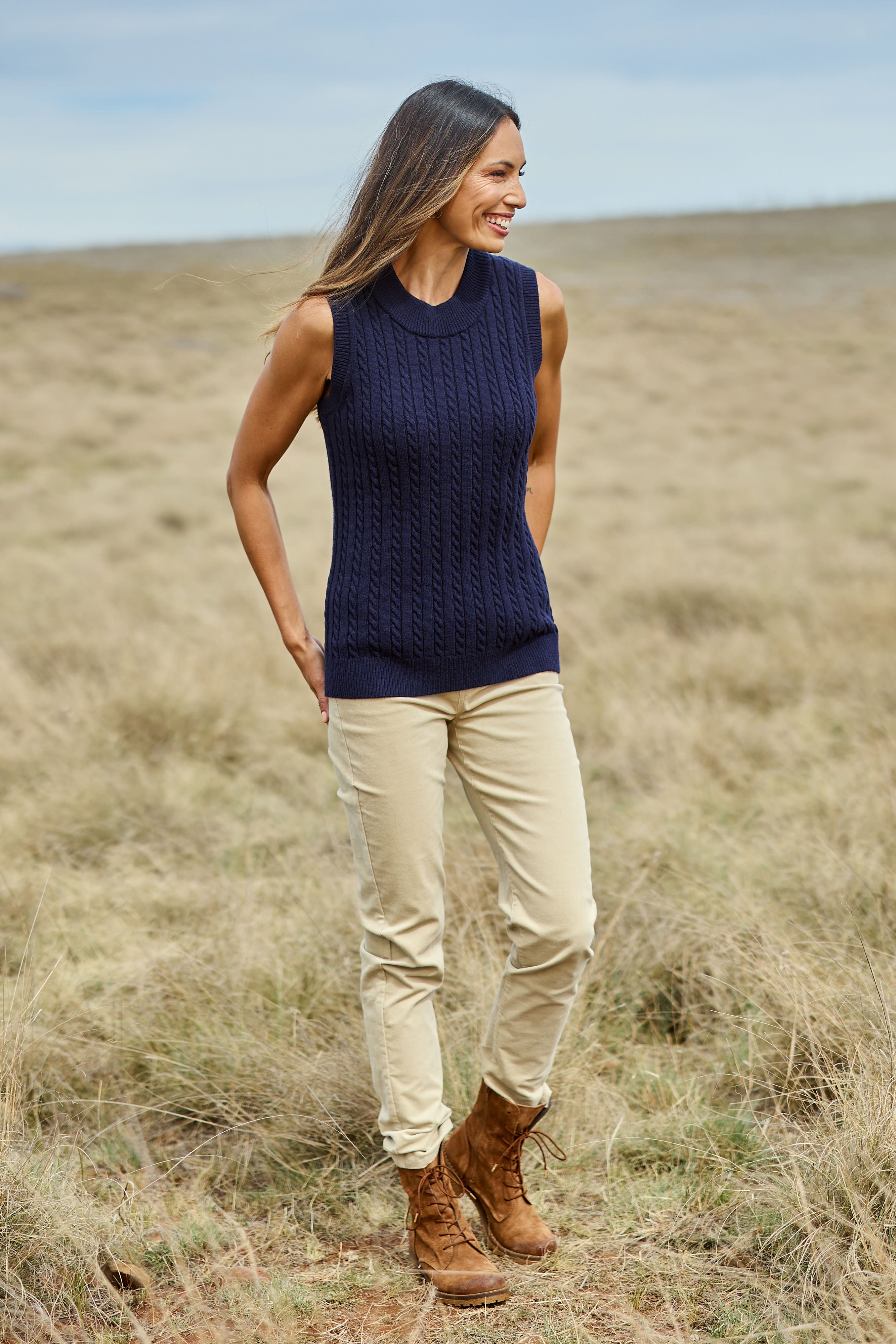 Model Amanda wearing size S of The Soft Sleeveless Cable Knit Jumper in colour Richnavy (Blue), from the front, showing the whole outfit