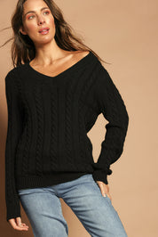 Model Madeline wearing size S of The V Neck Cable Knit Jumper in colour Black (Black), from the front, showing the whole outfit