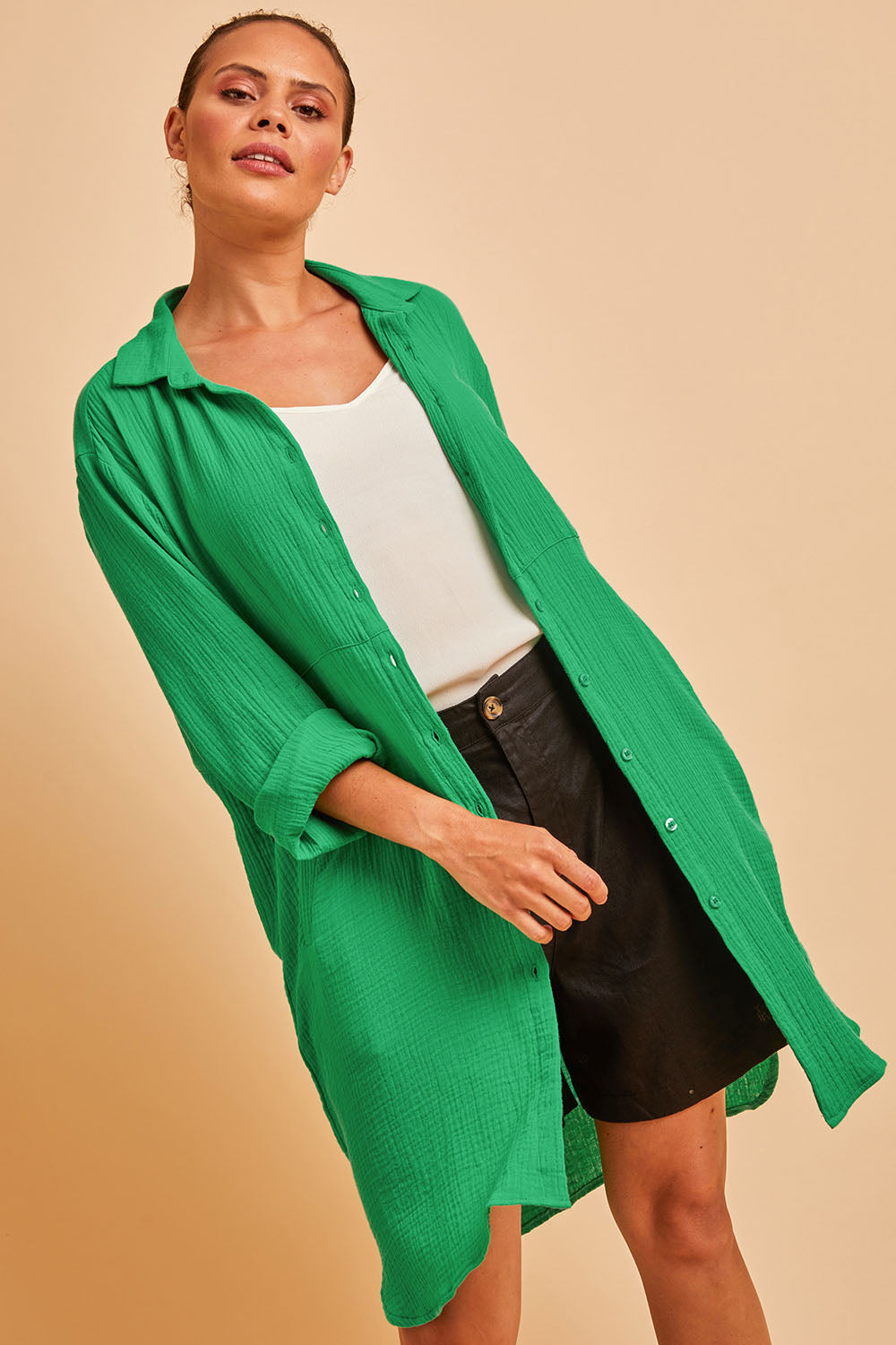 Model Lala wearing size 10 of The Double Cotton Long Overshirt in colour Emerald (Green), from the front, cropped image