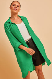 Model Lala wearing size 10 of The Double Cotton Long Overshirt in colour Emerald (Green), from the front, cropped image