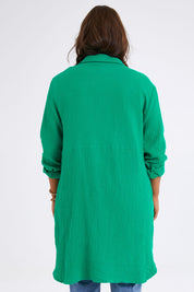 Model Monique wearing size 14 of The Double Cotton Long Overshirt in colour Emerald (Green), from the back