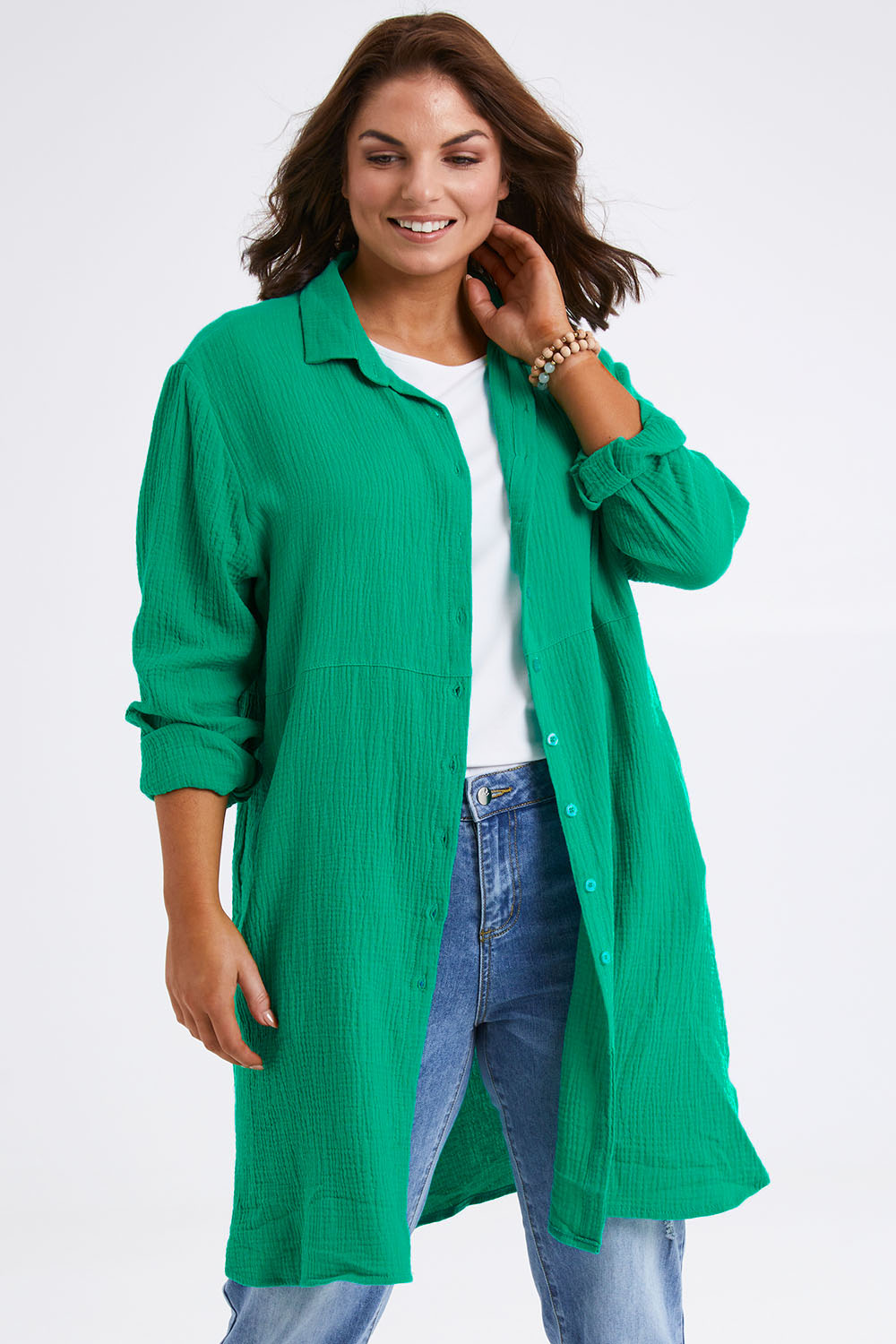 Model Monique wearing size 14 of The Double Cotton Long Overshirt in colour Emerald (Green), from the front, cropped image