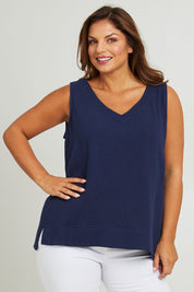Model Monique wearing size 14 of The Double Cotton V Tank in colour Navy (Blue), from the front, cropped image
