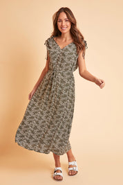 Model Madeline wearing size 10 of The Drawstring Printed Maxi Dress in colour Fernfloral (Green), from the front, showing the whole outfit