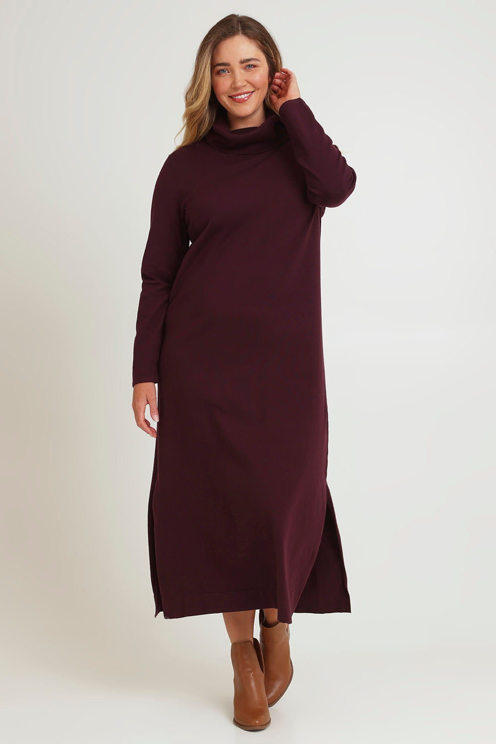 Model Chanel wearing size XL of The Roll Neck Knit Maxi Dress in colour Burntplum (Purple), from the front, showing the whole outfit
