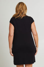 Model Fiona wearing size 16 of The Luxe Twist Detail Tee Dress in colour Black (Black), from the back