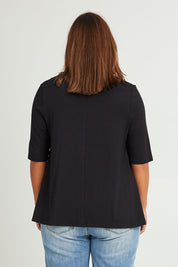 Model Monique wearing size 14 of The Luxe A Line Tee in colour Black (Black), from the back