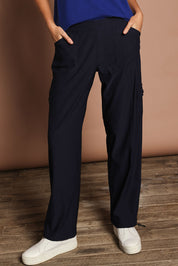 Model Madeline wearing size 10 of The Everyday Full Length Cargo Pant in colour Darknavy (Blue), from the front, cropped image