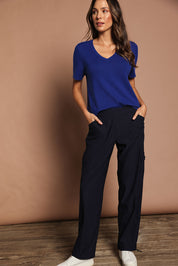 Model Madeline wearing size 10 of The Everyday Full Length Cargo Pant in colour Darknavy (Blue), from the front, showing the whole outfit