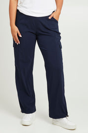 Model Monique wearing size 14 of The Everyday Full Length Cargo Pant in colour Navy (Blue), from the front, cropped image