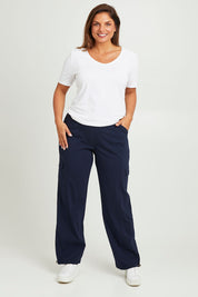 Model Monique wearing size 14 of The Everyday Full Length Cargo Pant in colour Navy (Blue), from the front, showing the whole outfit