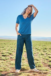Model Amanda wearing size 10 of The Everyday Full Length Cargo Pant in colour Petrol (Blue), from the front, showing the whole outfit