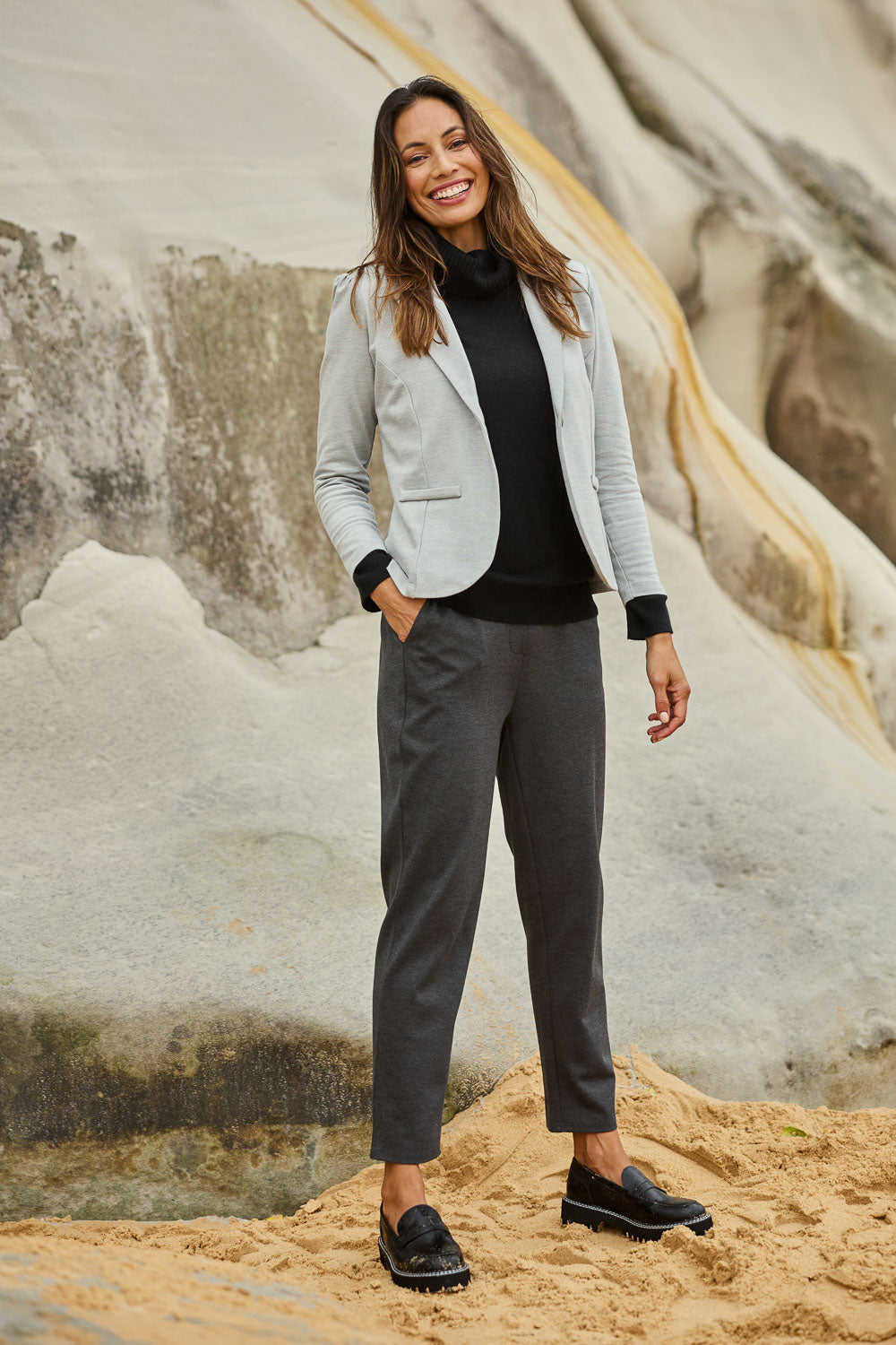 Model Amanda wearing size 10 of The Easy Wear Ponte Pant in colour Charcoal (Grey), from the front, showing the whole outfit