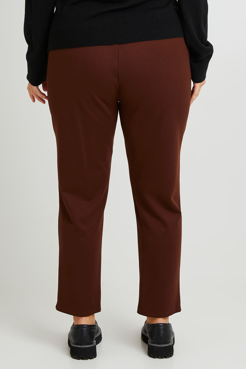 Model Laura wearing size 14 of The Easy Wear Ponte Pant in colour Chocolate, from the back