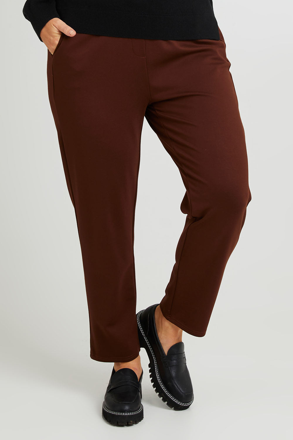 Model Laura wearing size 14 of The Easy Wear Ponte Pant in colour Chocolate, from the front, cropped image