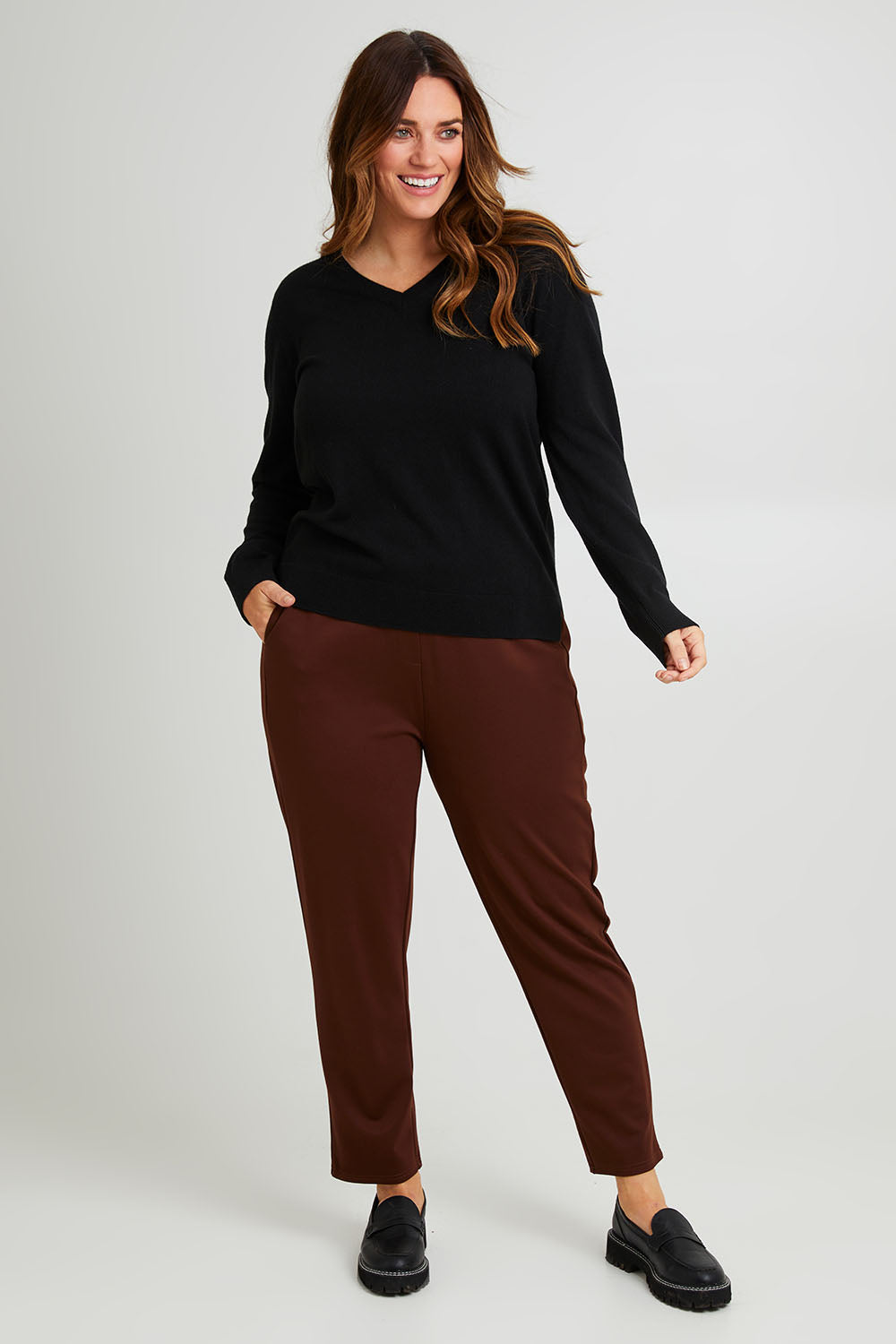 Model Laura wearing size 14 of The Easy Wear Ponte Pant in colour Chocolate, from the front, showing the whole outfit