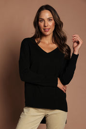 Model Madeline wearing size S of The High Low V Neck Jumper in colour Black (Black), from the front, showing the whole outfit