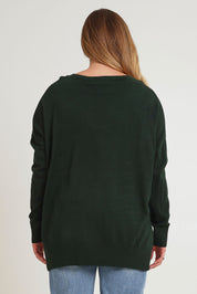 Model Chanel wearing size XL of The High Low V Neck Jumper in colour Forest (Green), from the back