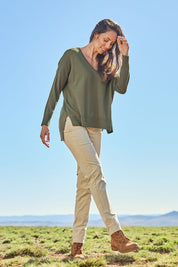 Model Amanda wearing size S of The High Low V Neck Jumper in colour Khaki (Green), from the front, showing the whole outfit
