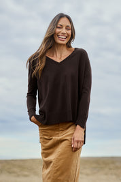 Model Amanda wearing size S of The High Low V Neck Jumper in colour Sable, from the front, showing the whole outfit