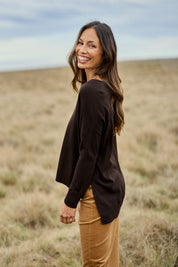 Model Amanda wearing size S of The High Low V Neck Jumper in colour Sable, from the front, showing the whole outfit