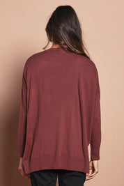 Model Amanda wearing size S of The High Low V Neck Jumper in colour Smokeyrose (Pink), from the back
