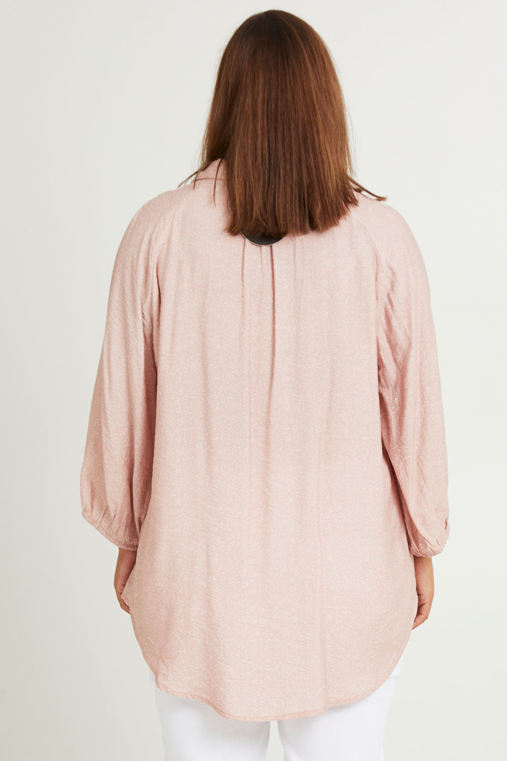 Model Monique wearing size 14 of The Keepers Soft Relaxed Fit Shirt in colour Dustypink (Pink), from the back