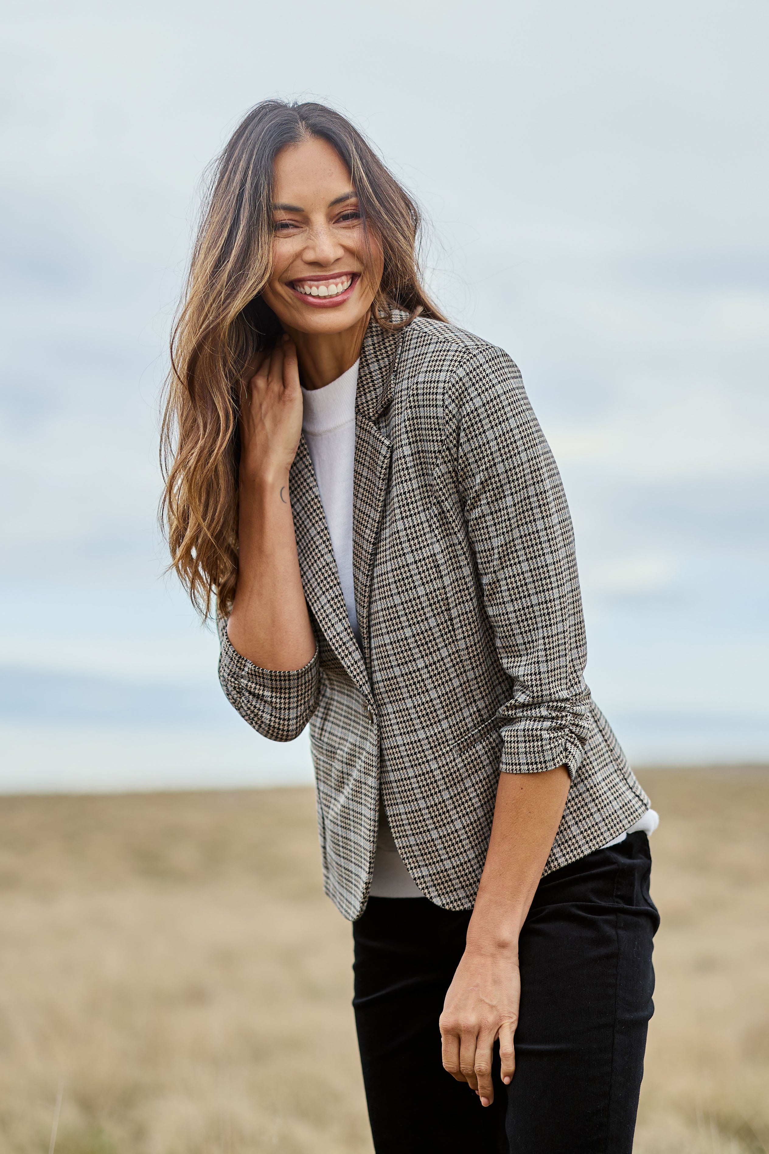 Model Amanda wearing size 10 of The Keepers Houndstooth Blazer in colour Blackblue (Black), from the front, showing the whole outfit