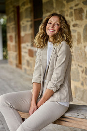 Model Emma wearing size 10 of The Keepers Houndstooth Blazer in colour Tanivory, from the front, showing the whole outfit