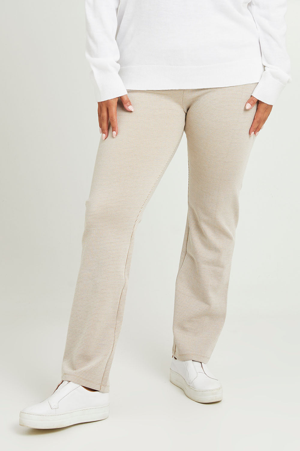Model Monique wearing size 14 of The Keepers Pull On Jacquard Pant in colour Tanivory, from the front, cropped image