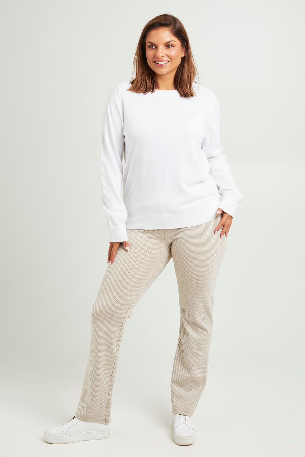 Model Monique wearing size 14 of The Keepers Pull On Jacquard Pant in colour Tanivory, from the front, showing the whole outfit