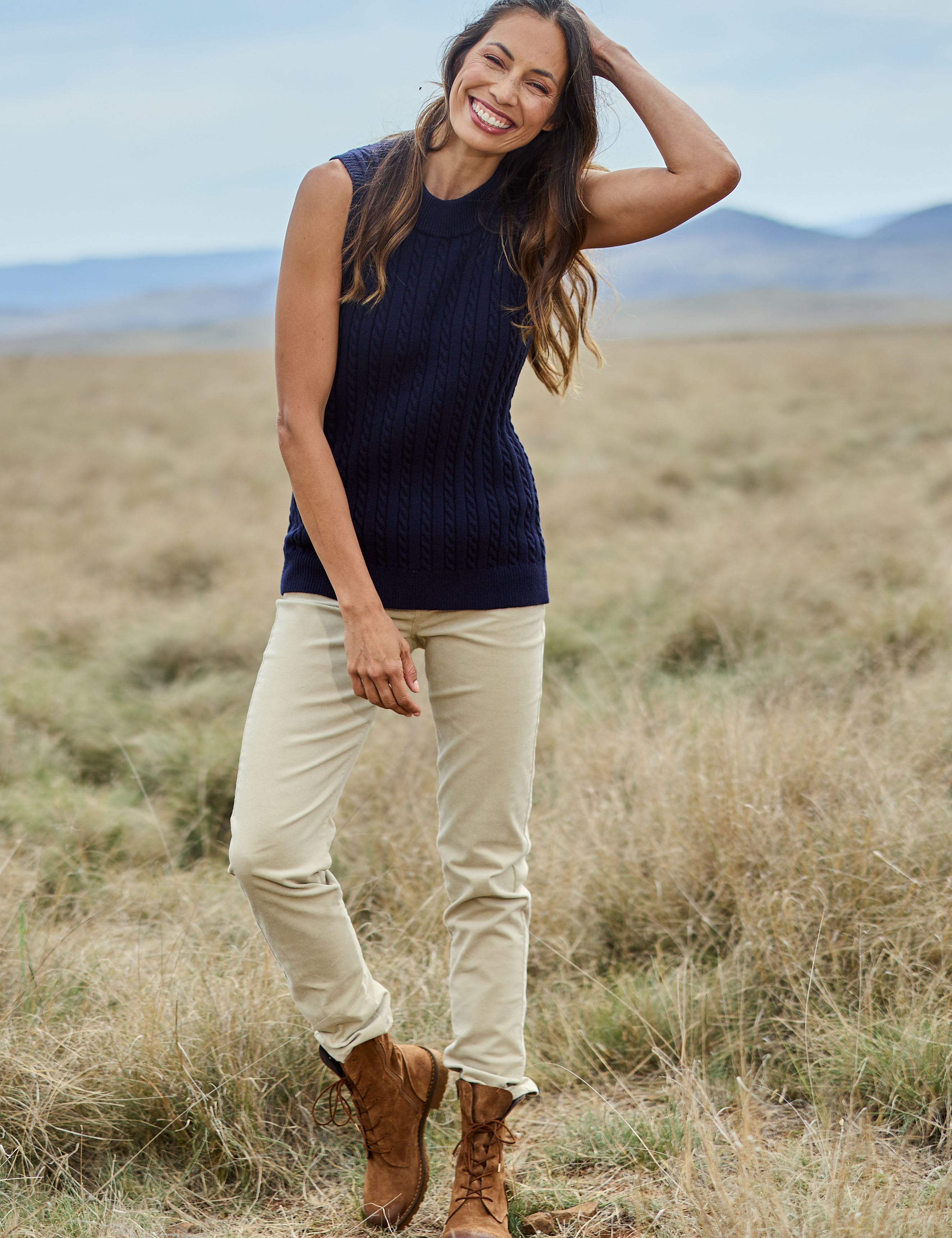 Model Amanda wearing size 10 of The Keepers Cord Pull On Pant in colour Almond, from the front, showing the whole outfit