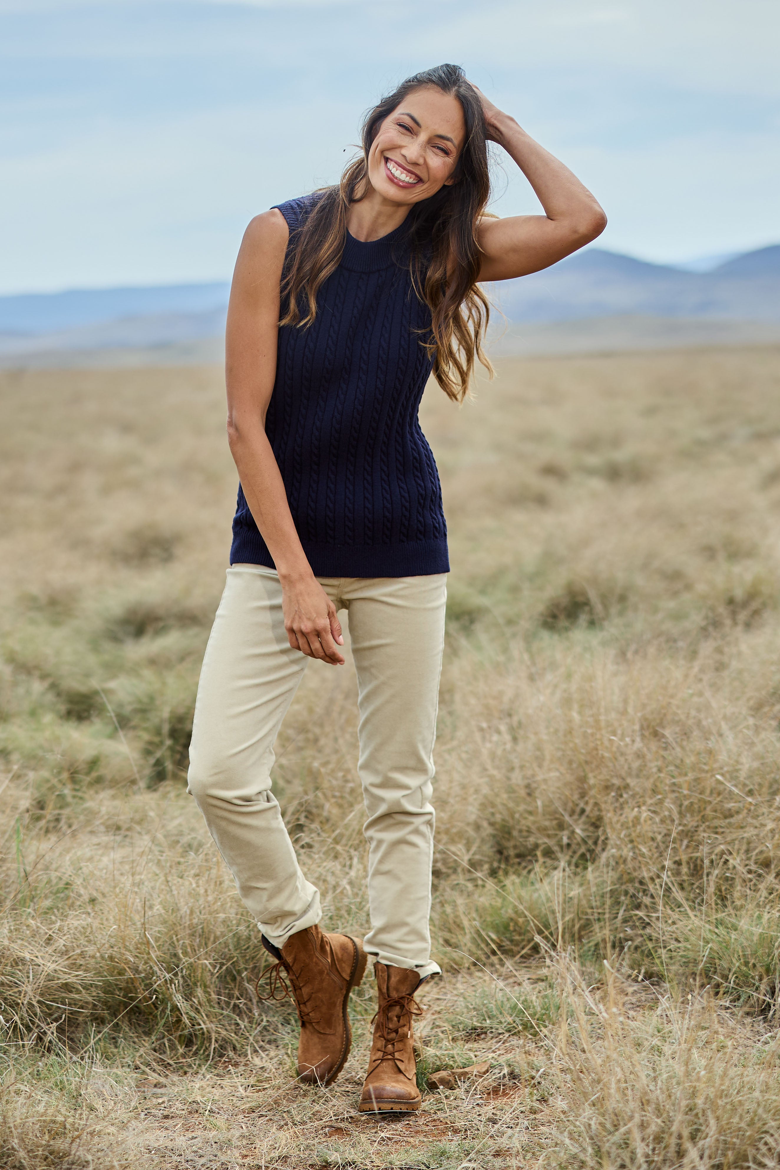 Model Amanda wearing size 10 of The Keepers Cord Pull On Pant in colour Almond, from the front, showing the whole outfit