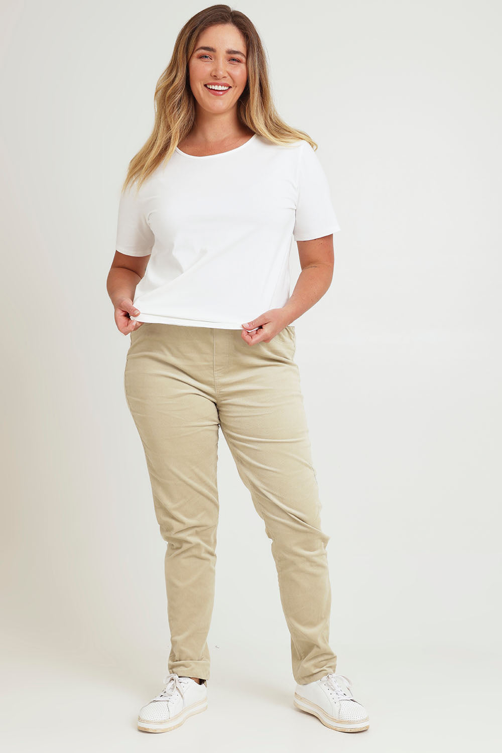 Model Chanel wearing size 16 of The Keepers Cord Pull On Pant in colour Almond, from the front, showing the whole outfit