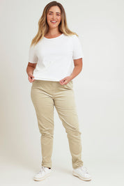 Model Chanel wearing size 16 of The Keepers Cord Pull On Pant in colour Almond, from the front, showing the whole outfit