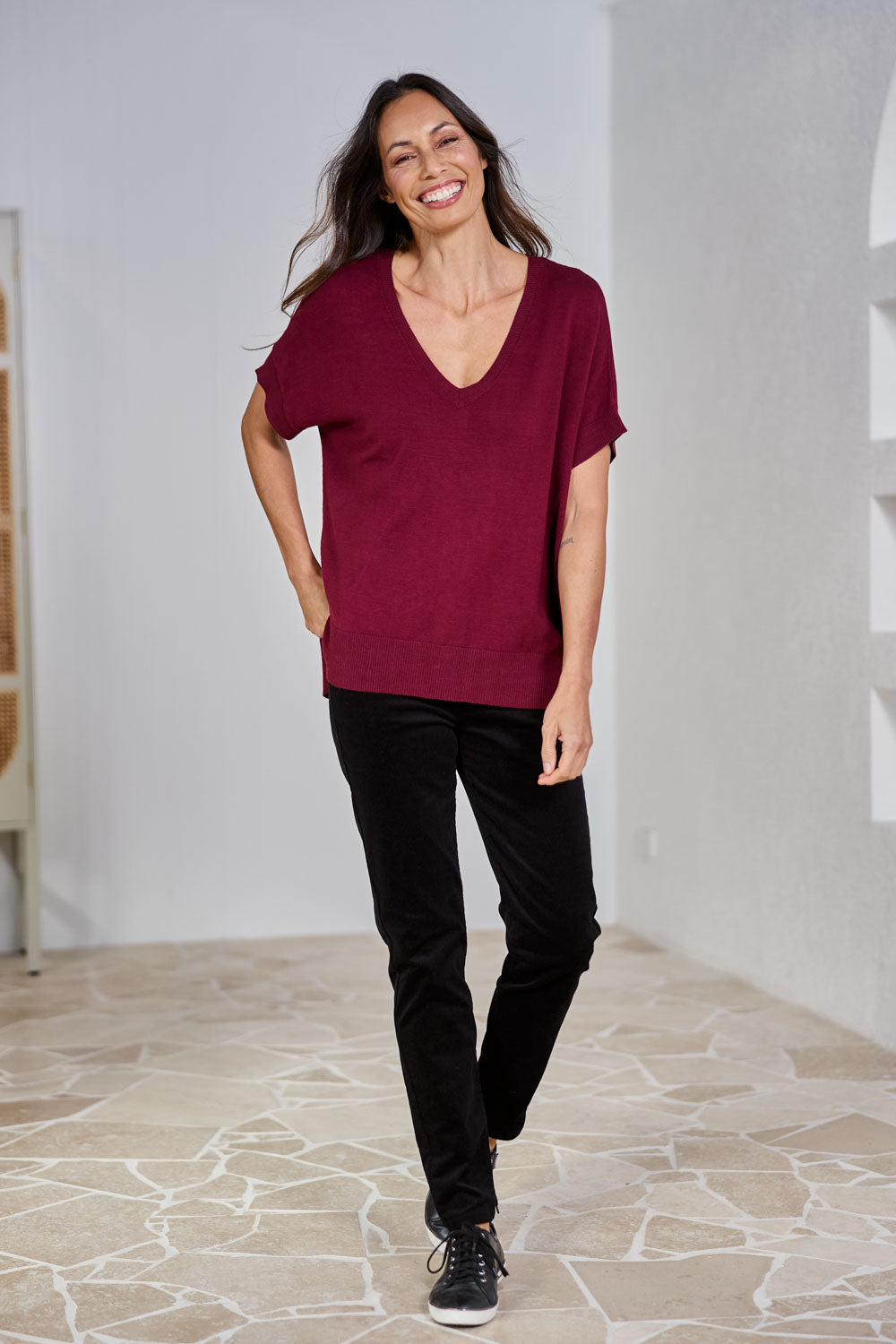 Model Amanda wearing size 10 of The Keepers Cord Pull On Pant in colour Black (Black), from the front, showing the whole outfit