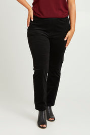 Model Monique wearing size 14 of The Keepers Cord Pull On Pant in colour Black (Black), from the front, cropped image