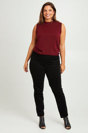 Model Monique wearing size 14 of The Keepers Cord Pull On Pant in colour Black (Black), from the front, showing the whole outfit