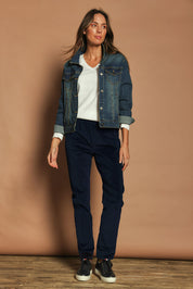 Model Madeline wearing size 10 of The Keepers Cord Pull On Pant in colour Darknavy (Blue), from the front, showing the whole outfit