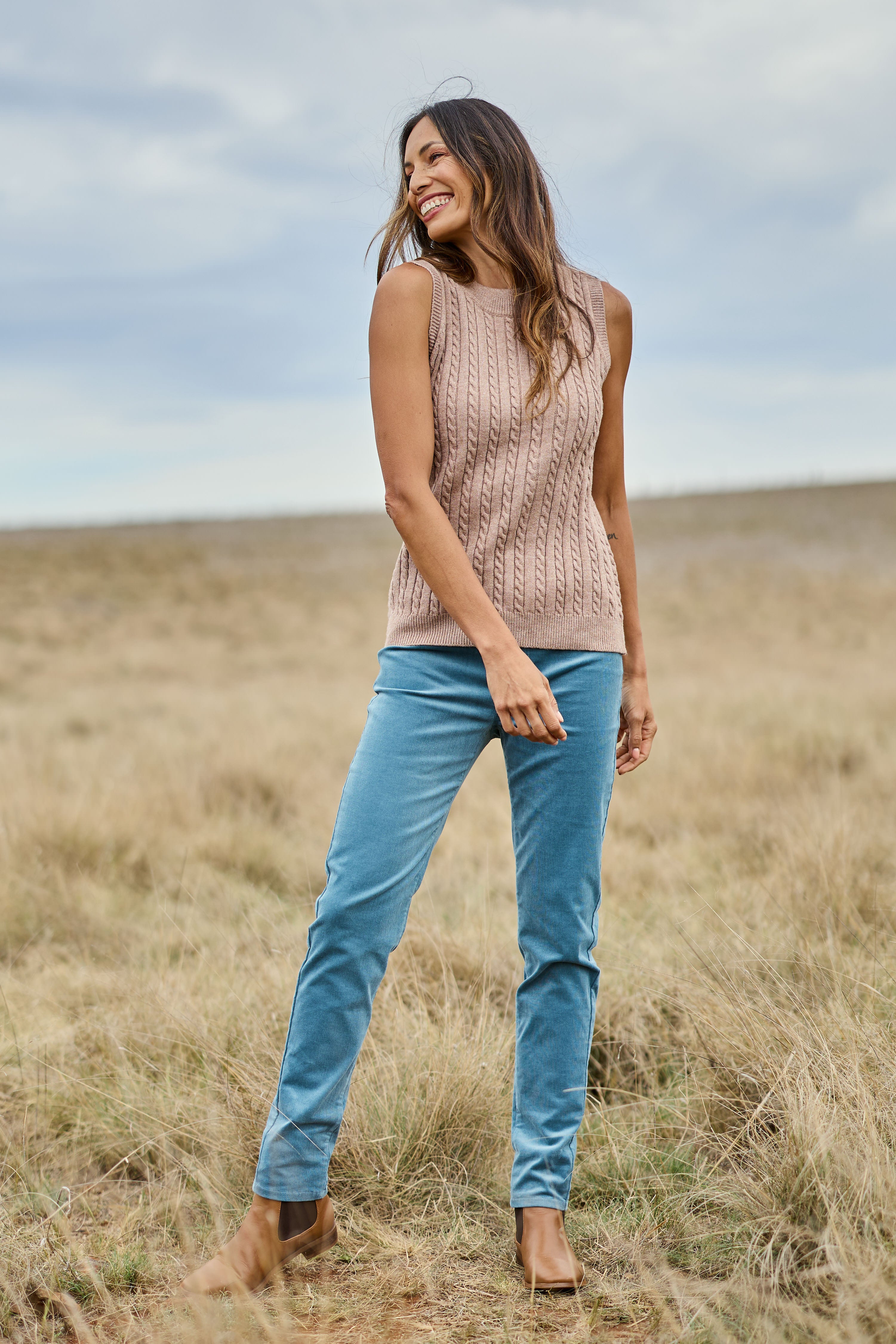 Model Amanda wearing size 10 of The Keepers Cord Pull On Pant in colour Denim (Blue), from the front, showing the whole outfit