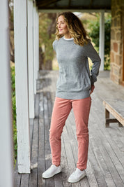 Model Emma wearing size 10 of The Keepers Cord Pull On Pant in colour Dustypink (Pink), from the front, showing the whole outfit