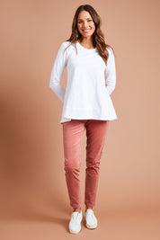 Model Madeline wearing size 10 of The Keepers Cord Pull On Pant in colour Dustypink (Pink), from the front, showing the whole outfit